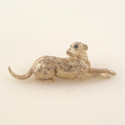 Appraisal: A ct gold wolfhound brooch by Harriet Glen with sapphire