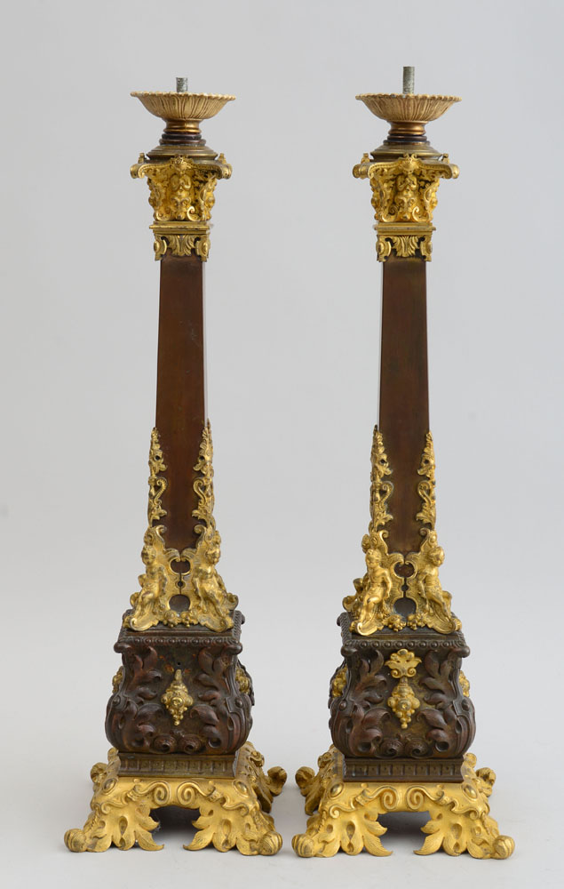 Appraisal: PAIR OF LOUIS-PHILIPPE STYLE GILT-METAL-MOUNTED COPPERIZED CANDLESTICKS Each angular stem