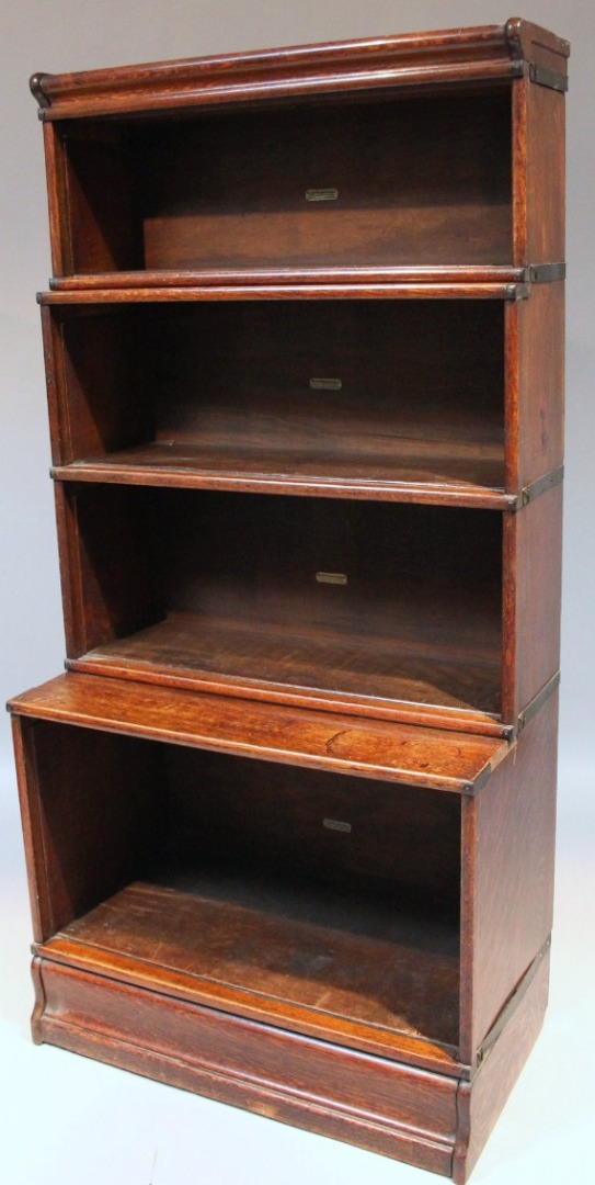 Appraisal: An early thC oak Globe Wernicke bookcase with four various