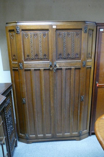 Appraisal: Large door carved oak linenfold style wardrobe with shaped front