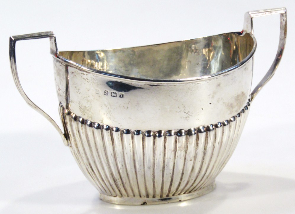 Appraisal: An Edwardian silver two handled sugar bowl of part gadrooned