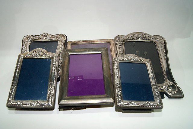 Appraisal: A PAIR OF SILVER PHOTO FRAMES of rectangular form with