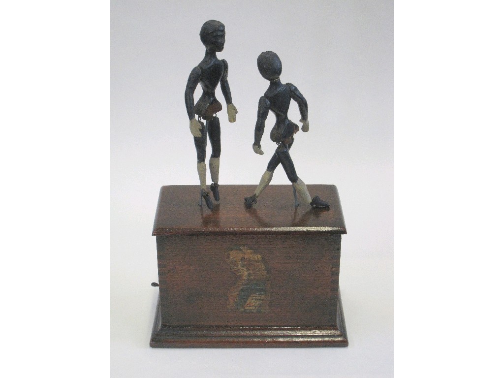 Appraisal: Late th Century child's automaton the clockwork movement with two