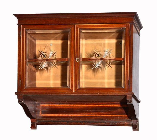 Appraisal: AN EDWARDIAN MAHOGANY AND INLAID HANGING CUPBOARD with sunburst design