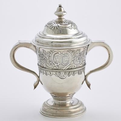 Appraisal: GEORGE III STERLING COVERED TROPHY CUP Rococo chasings knopped finial