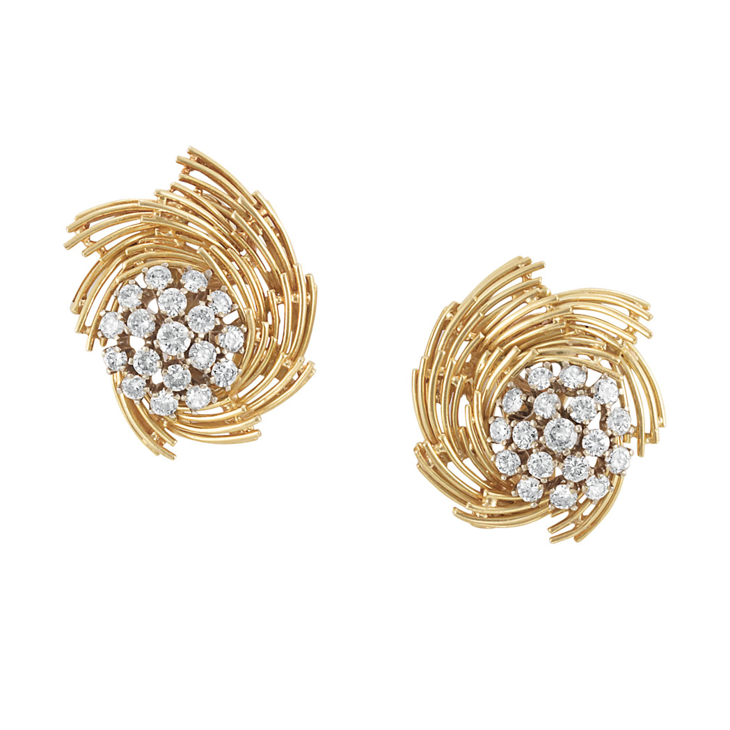 Appraisal: Pair of Gold and Diamond Earclips kt centering clusters of