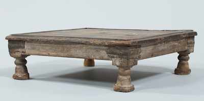 Appraisal: A Middle-Eastern Low Wood Table Low rustic wood table with