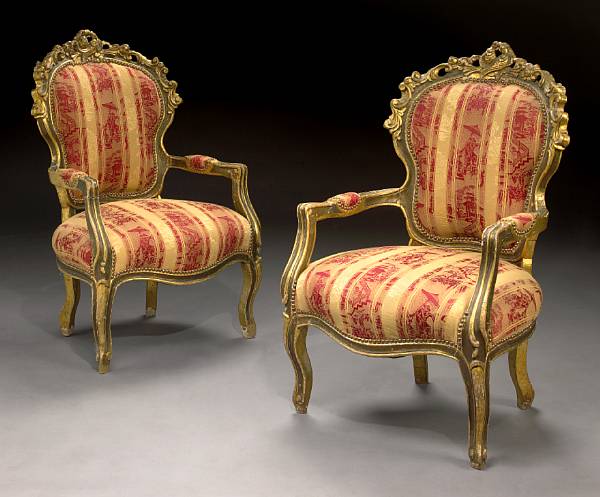 Appraisal: A pair of Italian Rococo style carved giltwood armchairs second