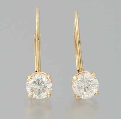 Appraisal: A Pair of Diamond Solitaire Earrings k yellow gold lever-back