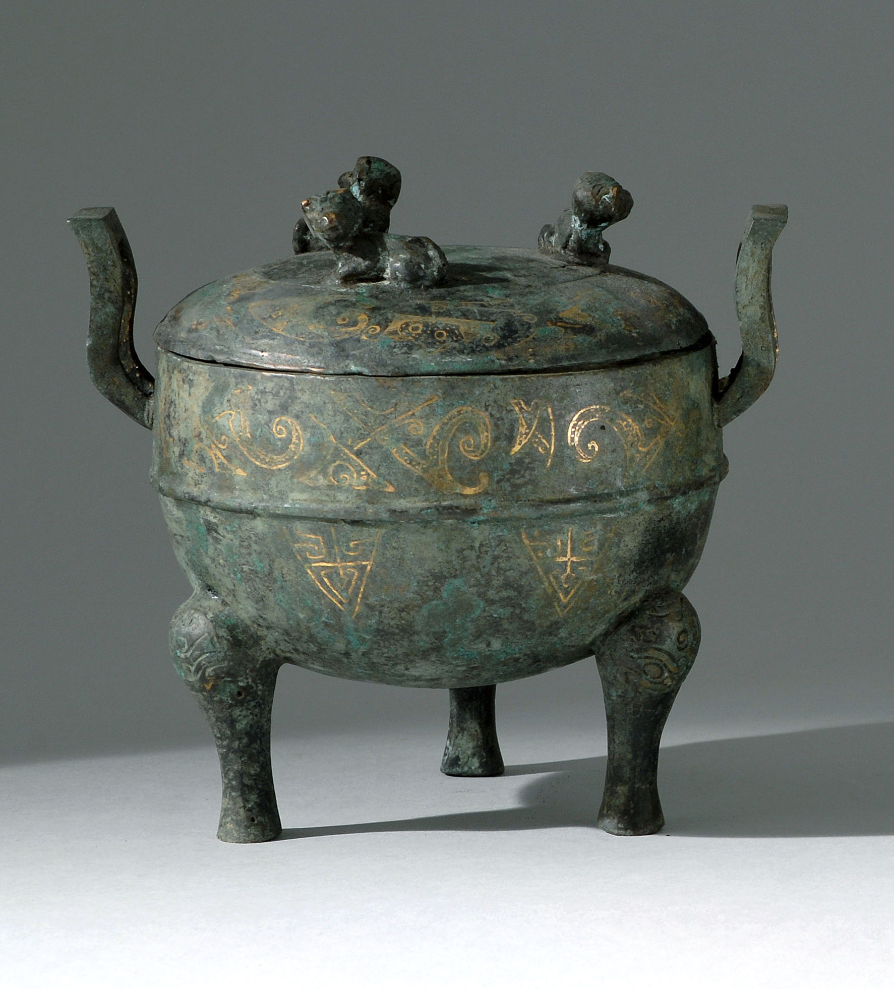 Appraisal: INLAID BRONZE TRIPOD CENSER Han StyleIn ovoid form with upswept