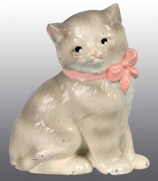 Appraisal: Cast Iron Kitten with Bow Paperweight Description Made by Hubley