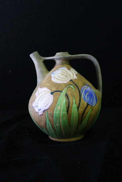 Appraisal: An Amphora Florina jug enriched with polychrome glazed flowers on