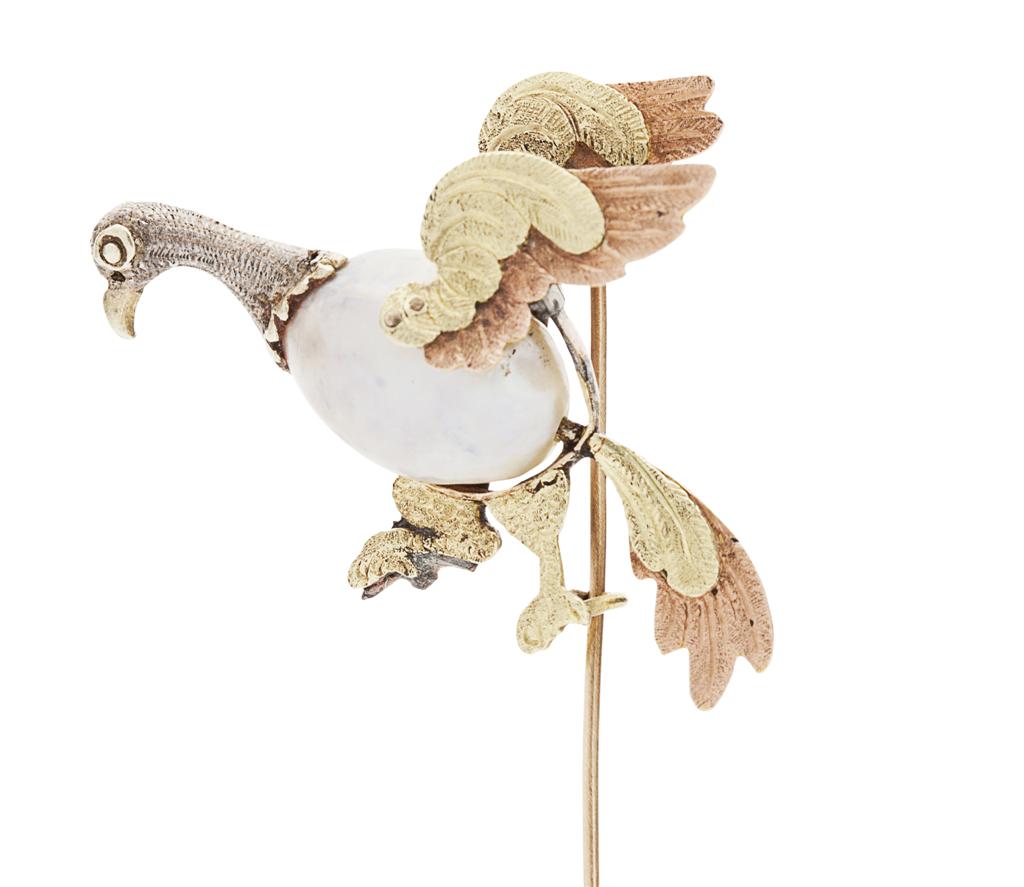 Appraisal: A natural pearl set stick pin modelled as a bird