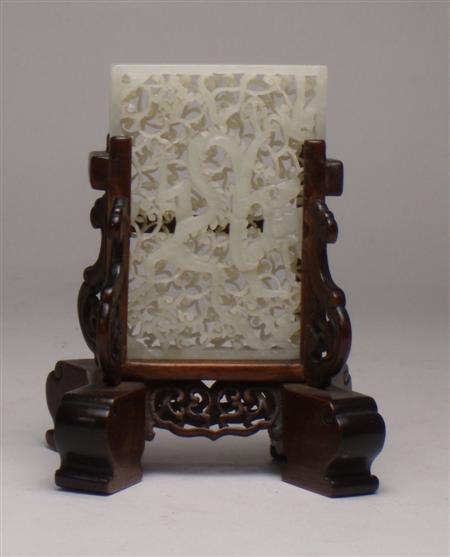 Appraisal: A Chinese white jade reticulated screen of a dragon on