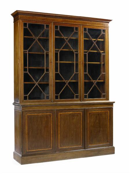 Appraisal: An Edwardian mahogany and satinwood crossbanded cupboard bookcase inlaid with