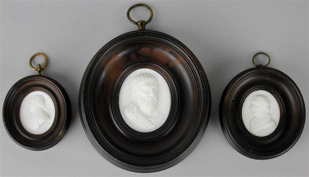 Appraisal: THREE GLASS PASTE PORTRAIT MEDALLIONS IN THE MANNER OF JAMES