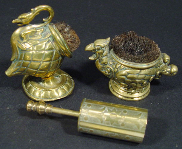 Appraisal: Three novelty brass pen wipes brushes inset into bird swan