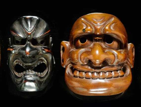 Appraisal: TWO NETSUKE A KY GEN BUAKU-MASK AND A SIGNED DEMON-MASK