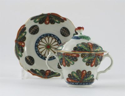 Appraisal: A Worcester chocolate cup cover and saucer painted with the