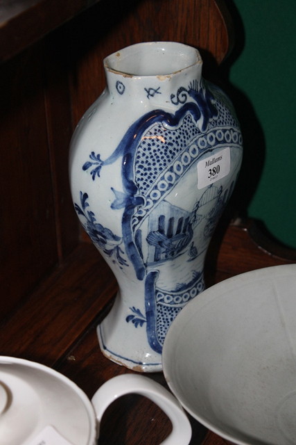 Appraisal: A DELFT BLUE AND WHITE POTTERY BALUSTER VASE th Century