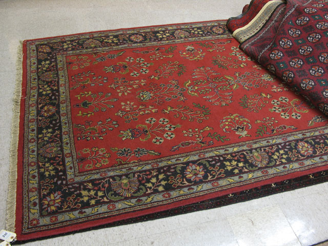 Appraisal: INDO-SAROUK CARPET floral design on red ground ' x '