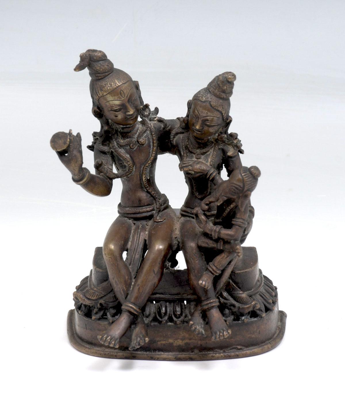 Appraisal: HINDU BRONZE FIGURAL GROUPING Bronze Shiva Parvati with Ganesh on