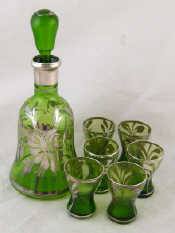 Appraisal: A continental liqueur set of a decanter and six glasses