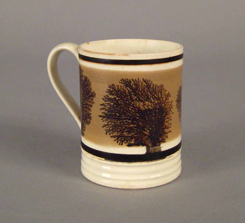 Appraisal: Mocha mug th c with seaweed decoration on a clay