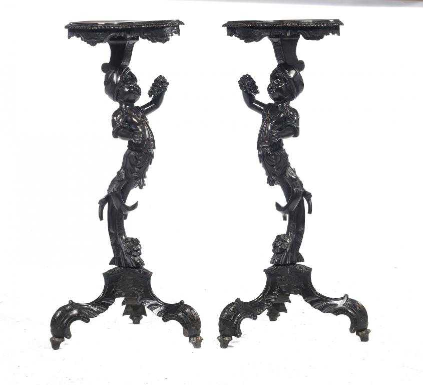 Appraisal: A PAIR OF ITALIAN CARVED WALNUT BLACKAMOOR TORCH RES the