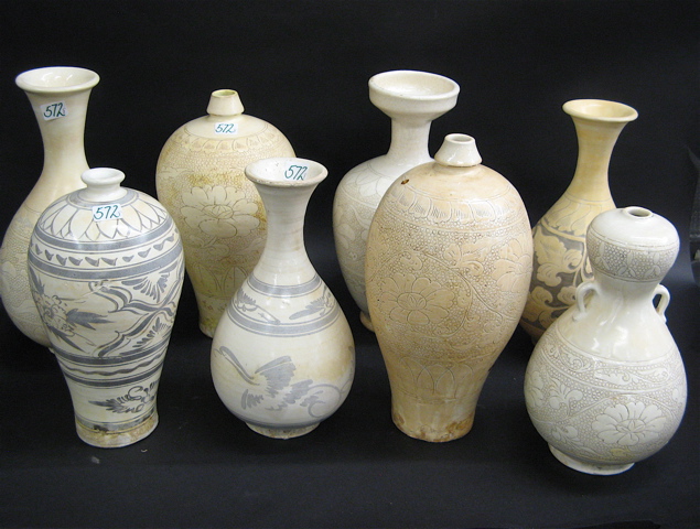 Appraisal: EIGHT CHINESE POTTERY VASES five white with carved decoration and