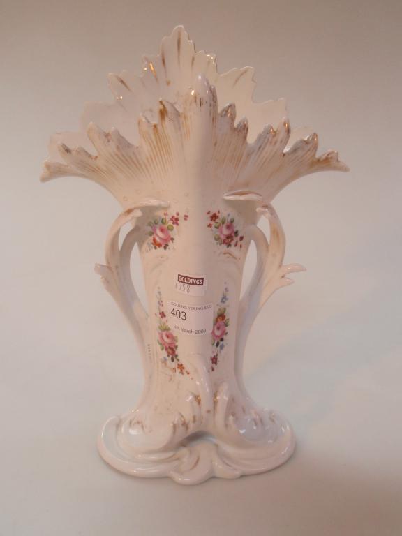 Appraisal: A thC porcelain vase with a irregular gilt rim painted