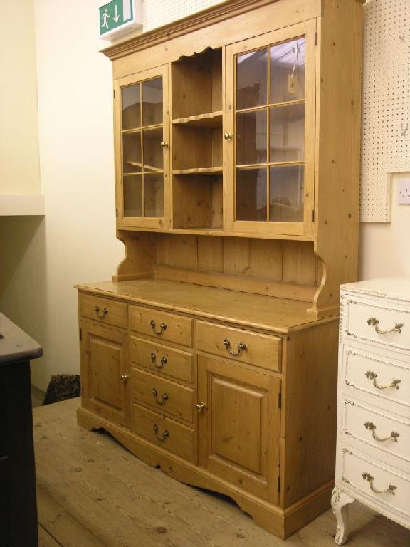 Appraisal: A waxed pine dresser upper stage with three open shelves