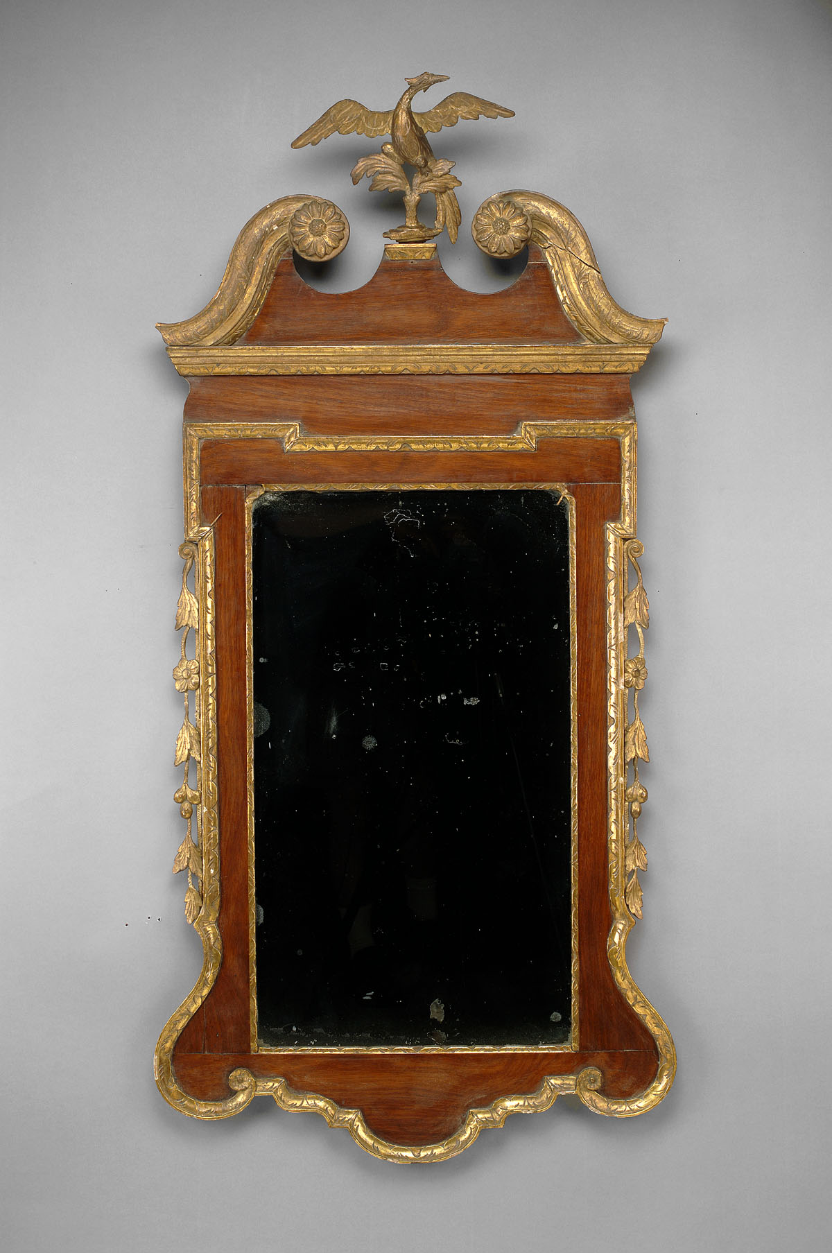 Appraisal: CHIPPENDALE MAHOGANY AND PARCEL GILT CONSTITUTION PIER MIRROR The swan's