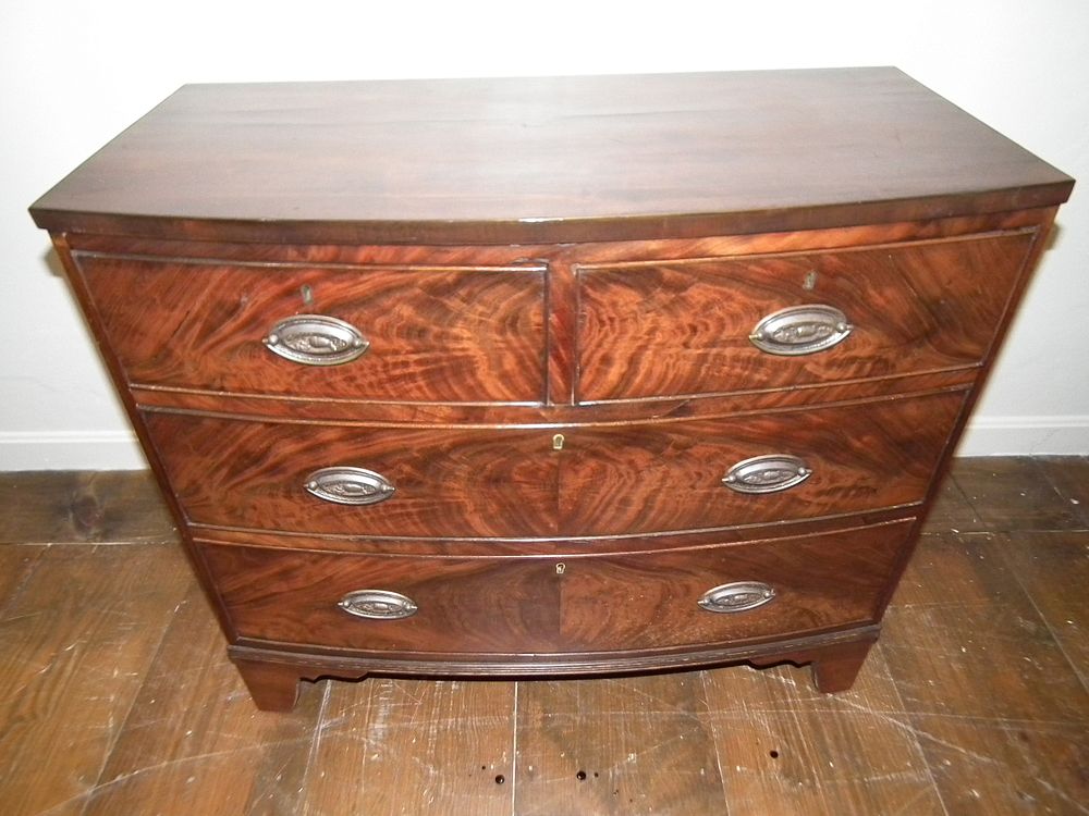 Appraisal: PERIOD BACHELORS CHEST Period English Hepplewhite mahogany bow front bachelors