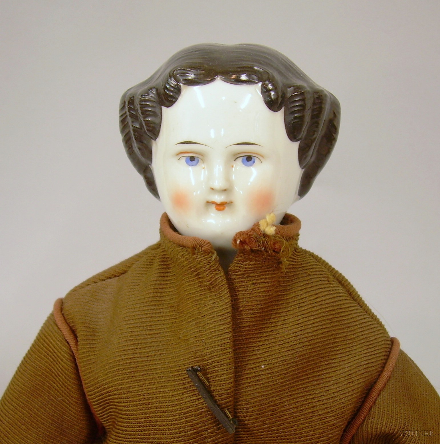 Appraisal: China Shoulder Head Doll with molded black flat-topped hair painted