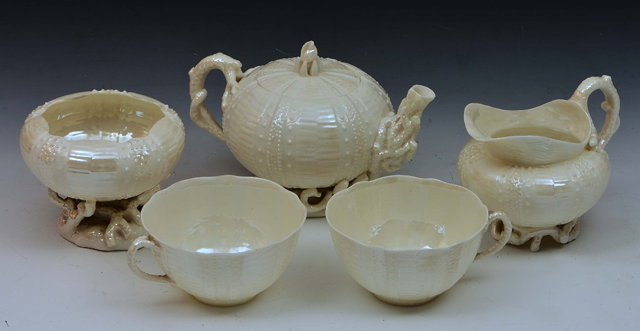 Appraisal: Belleek teapotand a milk jug a sugar basin two cups