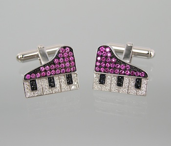 Appraisal: A Pair of Eccentric Ruby and Diamond Piano Cufflinks in