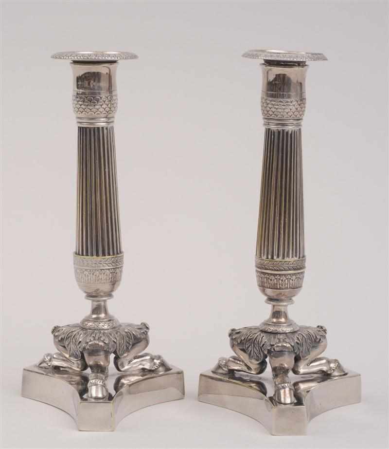 Appraisal: PAIR OF EMPIRE SILVER-PLATED COLUMN-FORM CANDLESTICKS Each reeded stem with