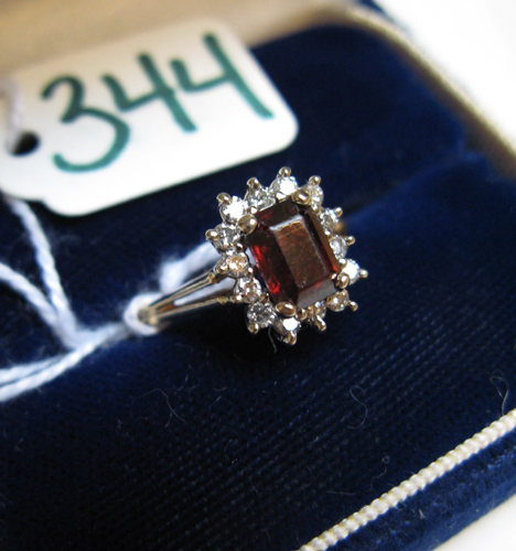 Appraisal: GARNET DIAMOND AND FOURTEEN KARAT GOLD RING centering a rectangular