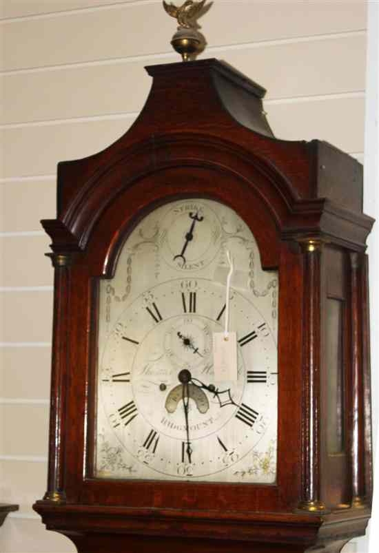 Appraisal: A George III oak longcase clock with silvered arched dial