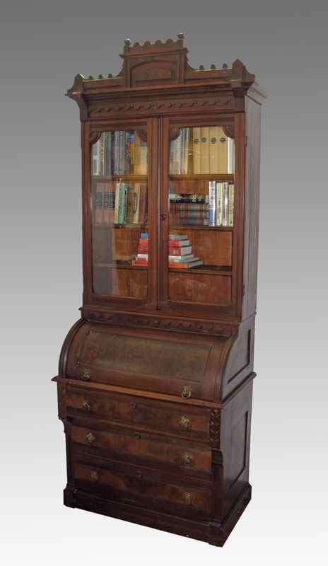 Appraisal: VICTORIAN CYLINDER ROLL TOP SECRETARY BOOKCASE Carved crest over glass