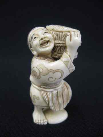 Appraisal: Carved Ivory Netsuke of a Man carrying a large basket