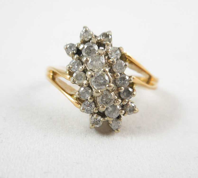 Appraisal: DIAMOND AND TEN KARAT GOLD CLUSTER RING set with round-cut