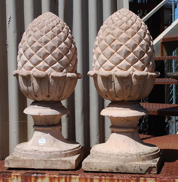 Appraisal: A PAIR OF RECONSTITUTED STONE ACORN FINIALS each on a