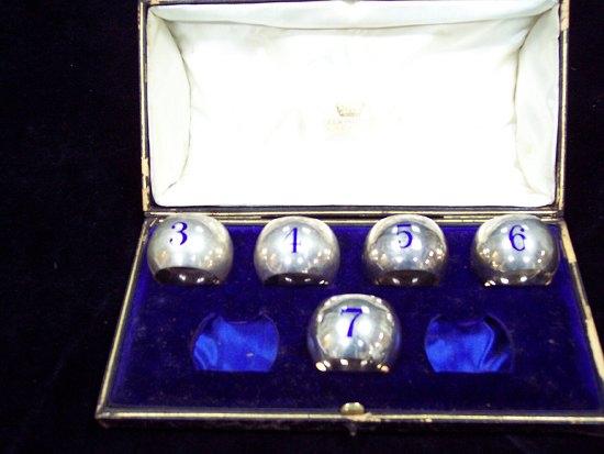 Appraisal: Five circular napkin rings numbered - in blue enamel initialled