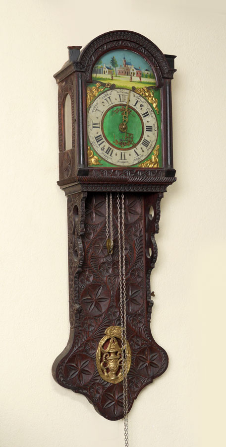 Appraisal: CARVED DUTCH TAIL WALL CLOCK Carved case with stylized floral