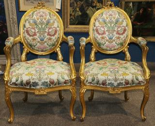 Appraisal: Pair of Louis XV style giltwood fauteuils Pair of Louis