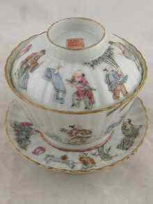 Appraisal: A Chinese ribbed tea bowl cover and saucer painted with