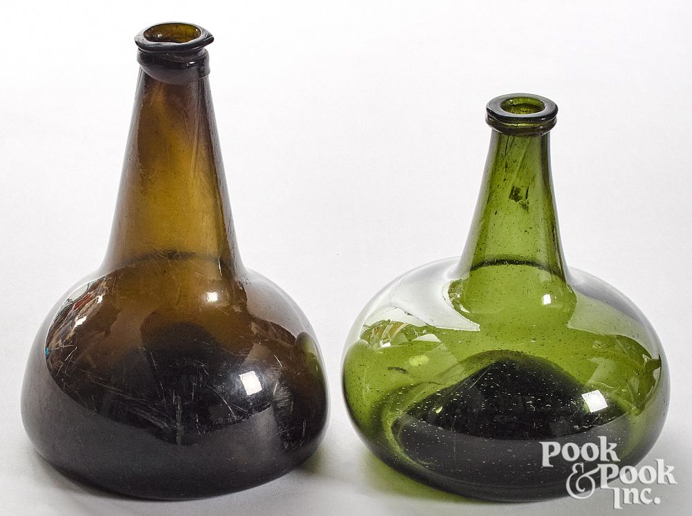 Appraisal: Two olive glass squat bottles late th c Two olive