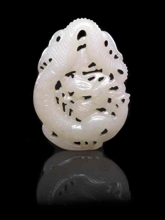 Appraisal: A White Jade Hanging Toggle of a Dragon having russet